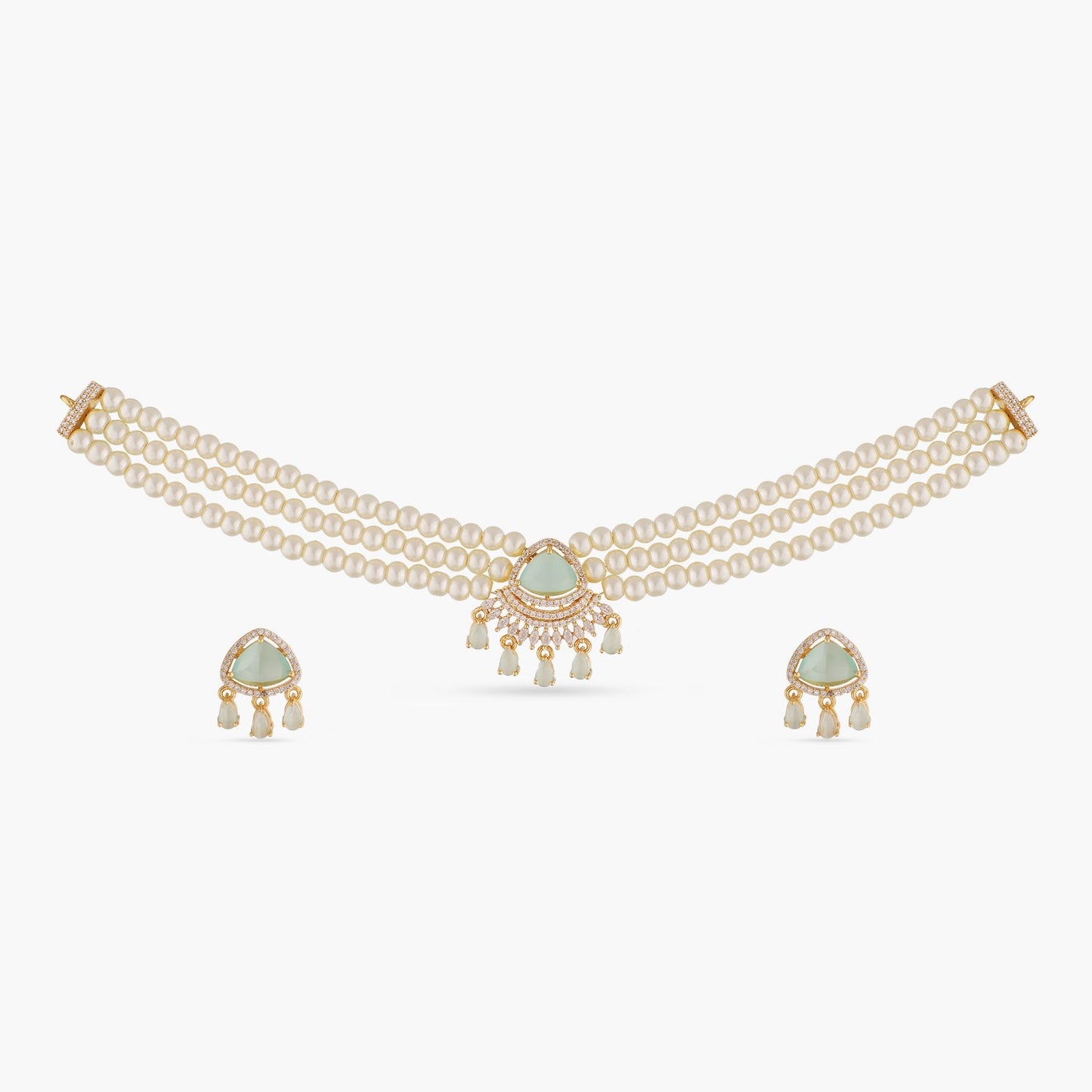 A picture of an Indian artificial jewelry set: a three layered pearl necklace and earrings featuring Cubic Zirconia and green gemstones.